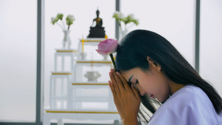 asian buddhist woman holding lotus and praying to 2025 02 22 03 51 46 utc 1